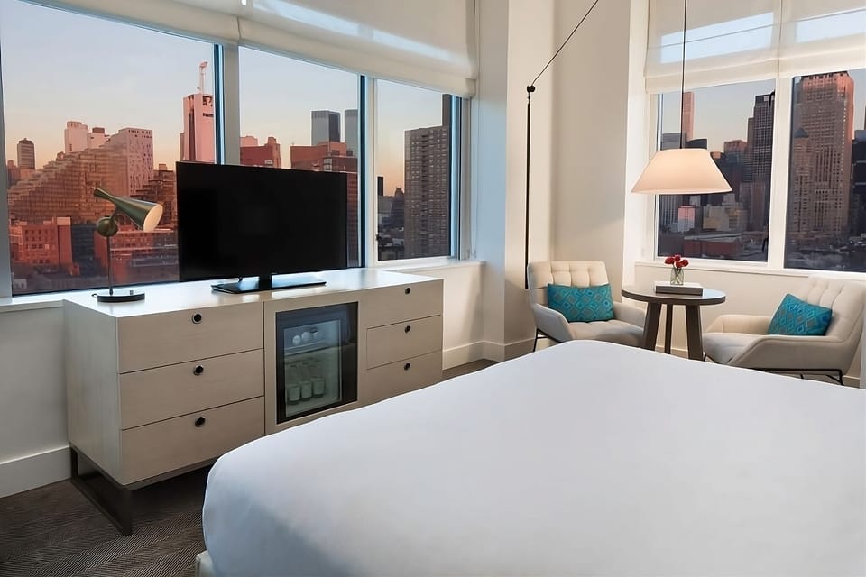 Settle in for sunset cityscapes from your cozy room.