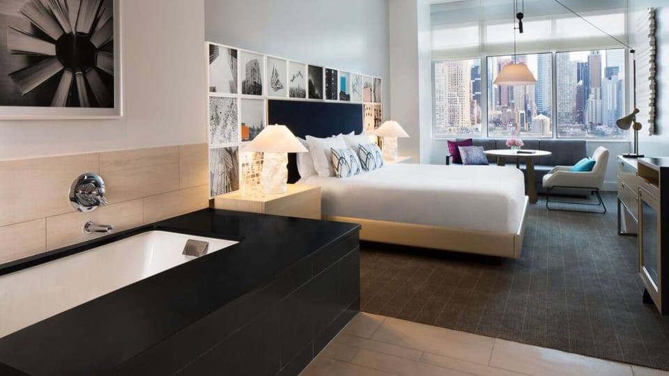 Indulge in a romantic soak with the city glittering beyond