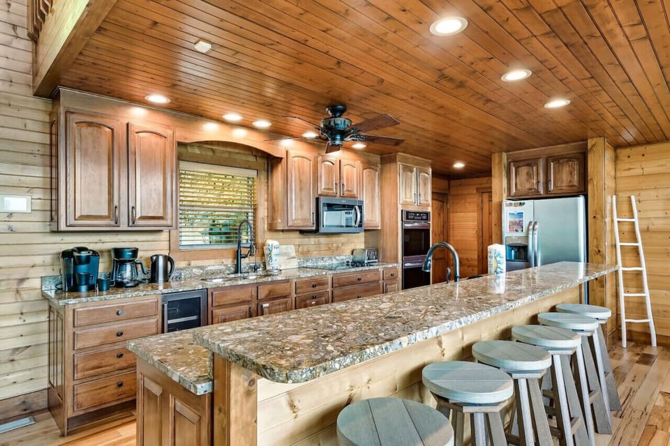 Two fully equipped kitchens. Double ovens. Keurig machine. Beverage cooler. Bar seating for 6. Two dishwashers. Two sinks. Microwave. Blender. 3 fridges (main kitchen, lower level kitchen, garage). Filtered water tap. Walk-in pantry.