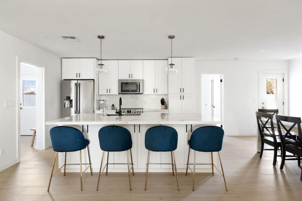 A bright and clean kitchen with plenty of counter space for morning coffee or a quick bite.