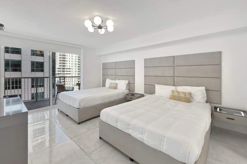 Bedroom features 2 queen beds
