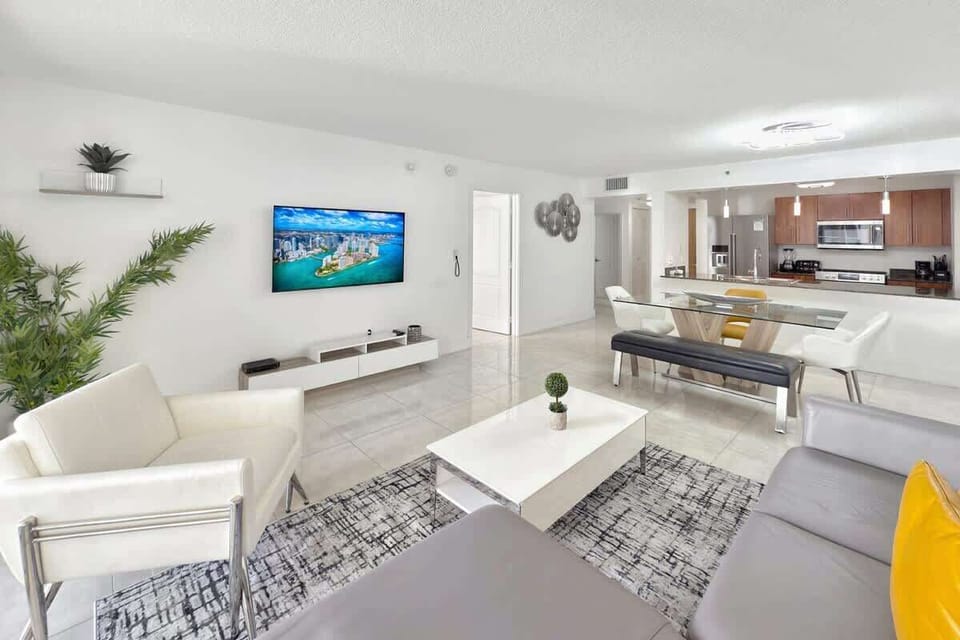 Living room features lush Italian sofa bed and 58" widescreen TV