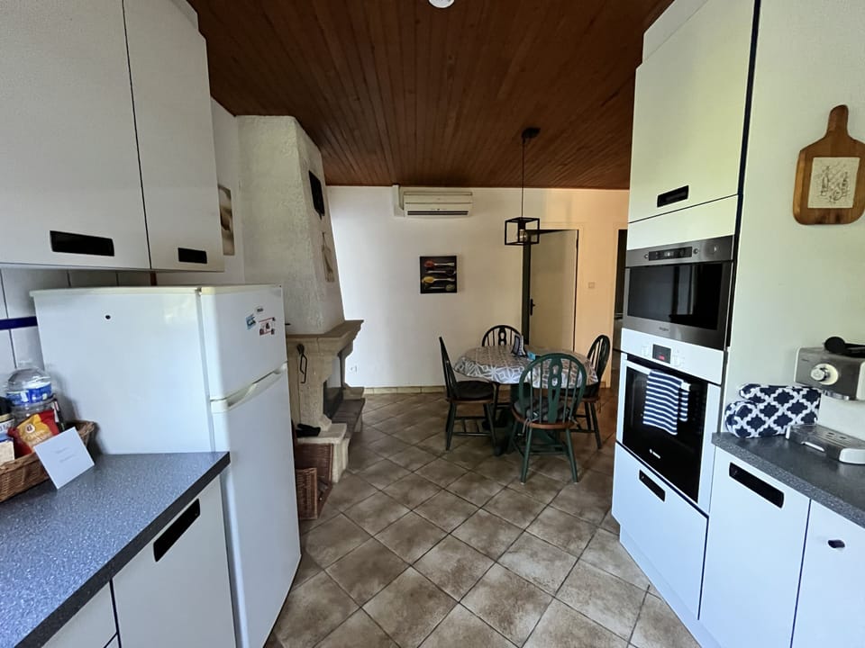 Kitchen with dining table and fireplace