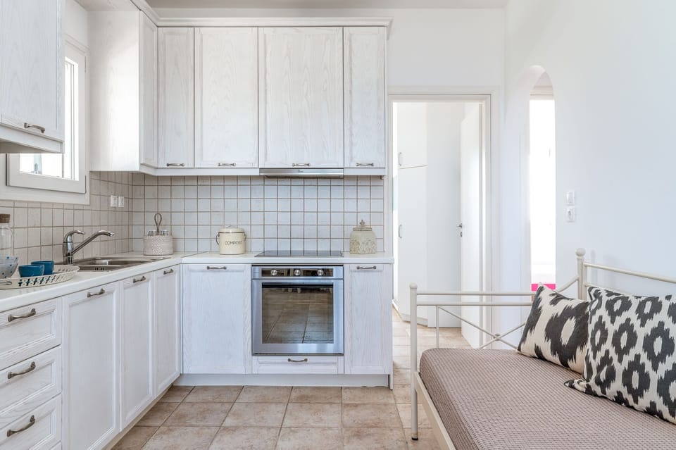 "Cook up a storm in our clean, white, and wooden kitchen"