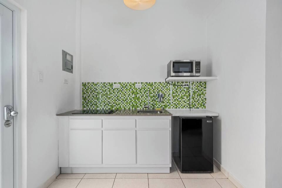 The kitchen is fully stocked with essential amenities for cooking and dining, such as a stove, oven, refrigerator, microwave, and other necessary appliances.