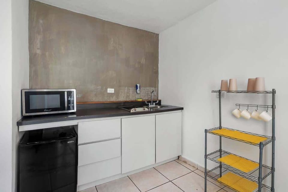 
Discover tranquility and serenity in this contemporary kitchen, complete with a captivating view that adds to the ambiance of relaxation and peacefulness.