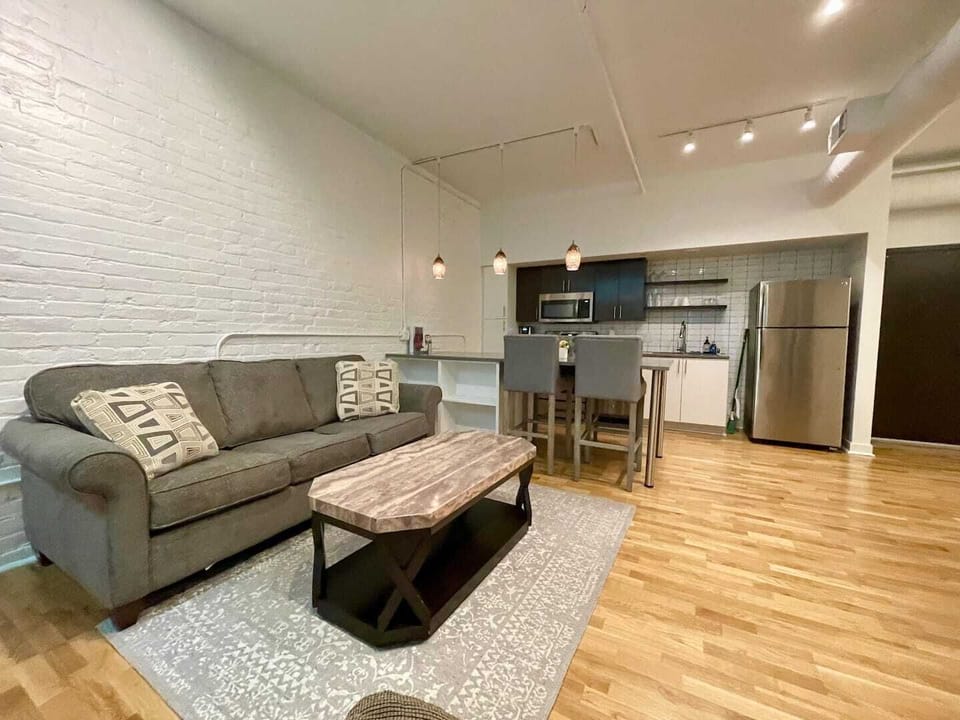 Main living room space with sleeper sofa in 408