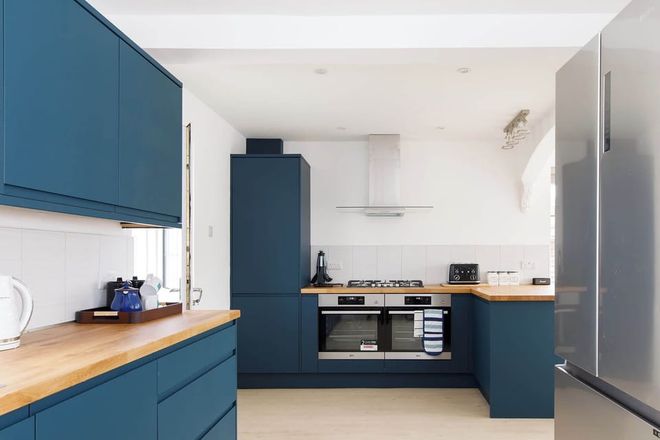 The kitchen has spacious countertops, giving plenty of room to cook up a storm or prepare beach picnics.