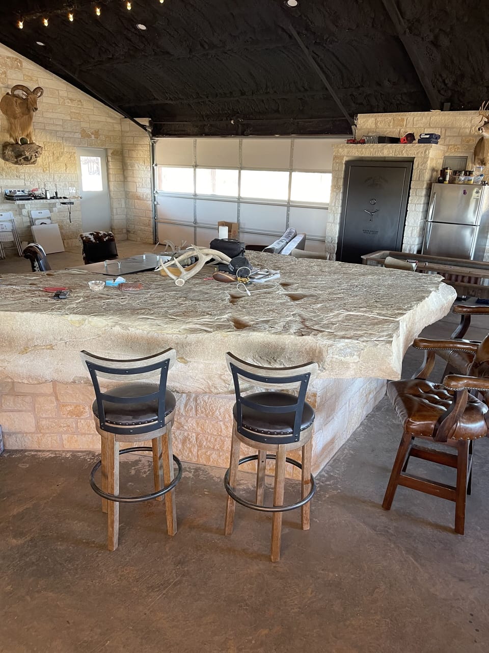 Huge limestone bar, sourced off the ranch and handcrafted by owner. 