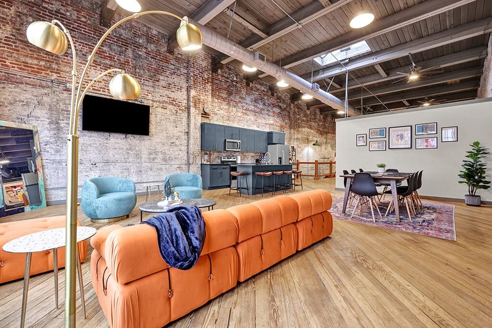 Orange couch replaced to add more seating and comfort.