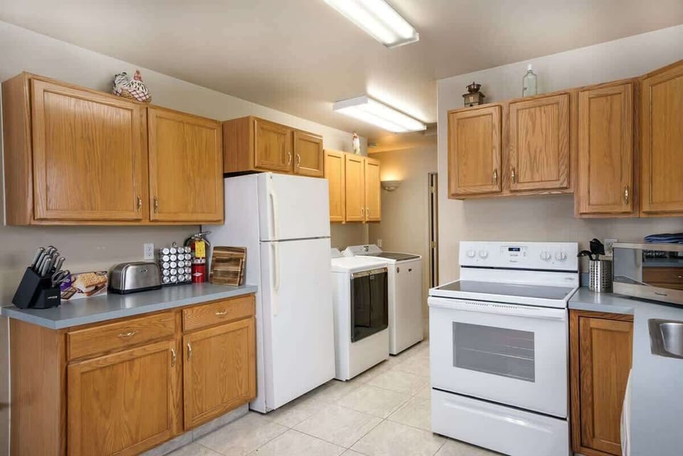 Fully equipped kitchen with cooking basics, spices, drip coffee maker, dishware/flatware, paper towels/trash bags and toaster.