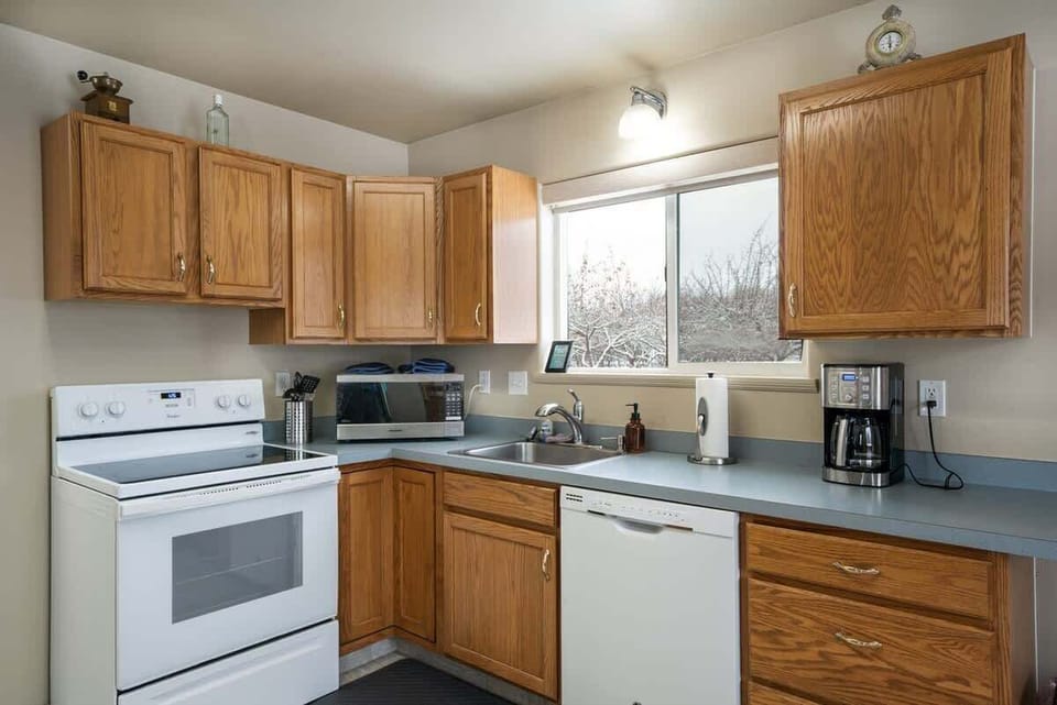Fully equipped kitchen with cooking basics, spices, drip coffee maker, dishware/flatware, paper towels/trash bags and toaster.