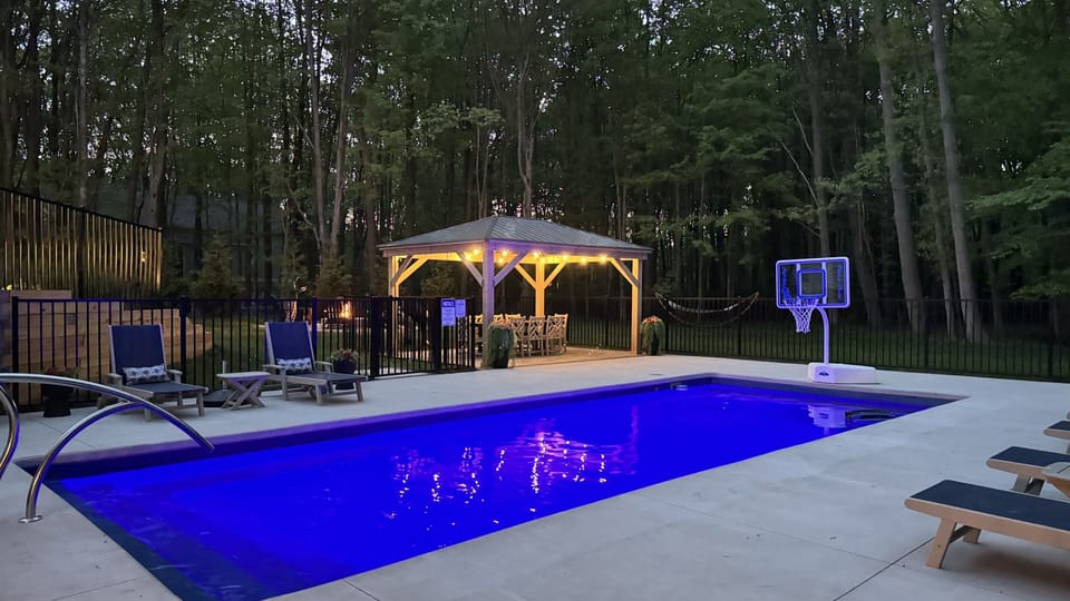 Soak up the sun on your pool deck — lounge chairs, crystal-clear water, and a whole afternoon with nowhere to be.