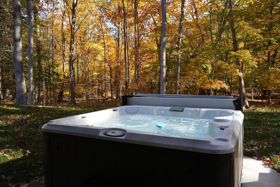 Sink into your private hot tub after dark — open year-round, perfect for cozy winter nights under the stars.