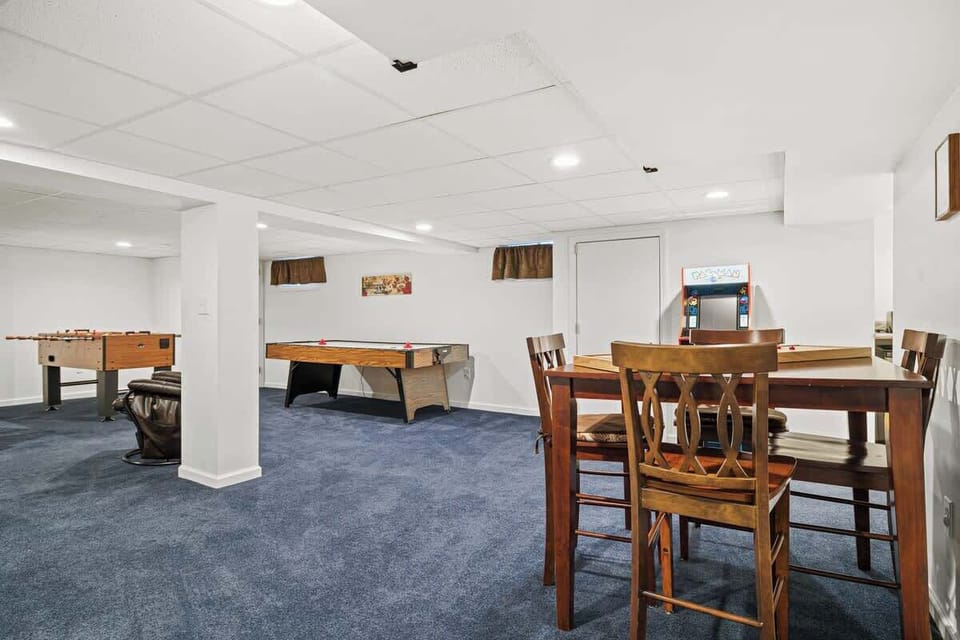 Downstairs offers fun arcade games such as air hockey, foosball, Pacman, shuffleboard and a table for cards or other games.