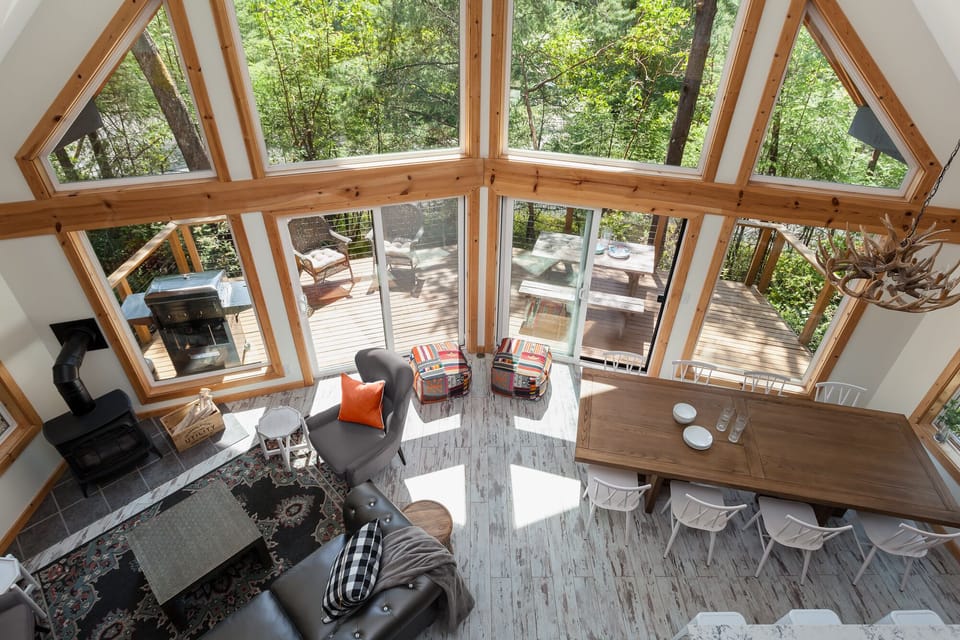 Living and Dining Room from Loft shows exterior deck.