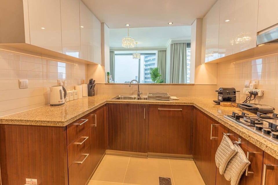 Kitchen: Sleek countertops and modern appliances await your culinary adventures!