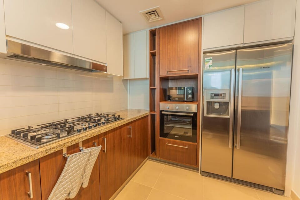 Kitchen: Whip up culinary delights in this modern kitchen with sleek appliances and ample space!