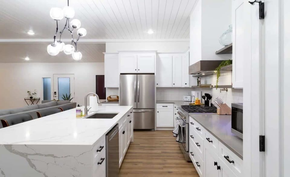Gorgeous custom gourmet kitchen w/ stainless steel appliances and quartz countertops
