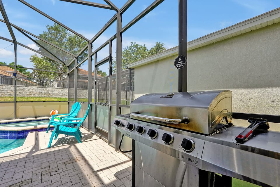 Covered lanai with gas BBQ grill - cookouts poolside after park days