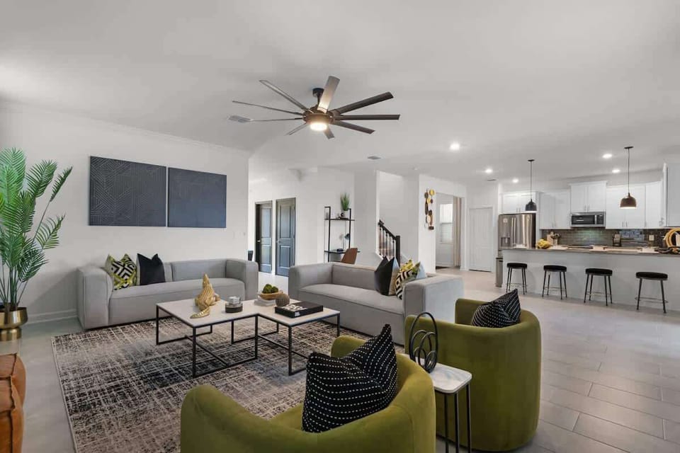 Back inside, our family room embraces modern comfort and connection with your family.