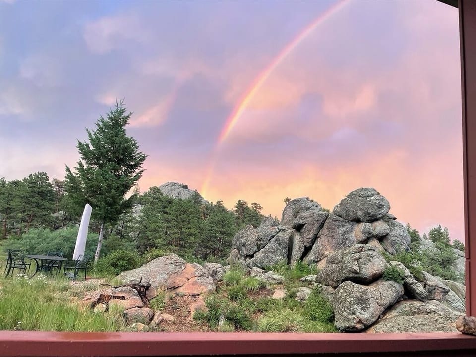 Rocks and rainbows & an outside dining area.  Can you spot a face in the rocks?