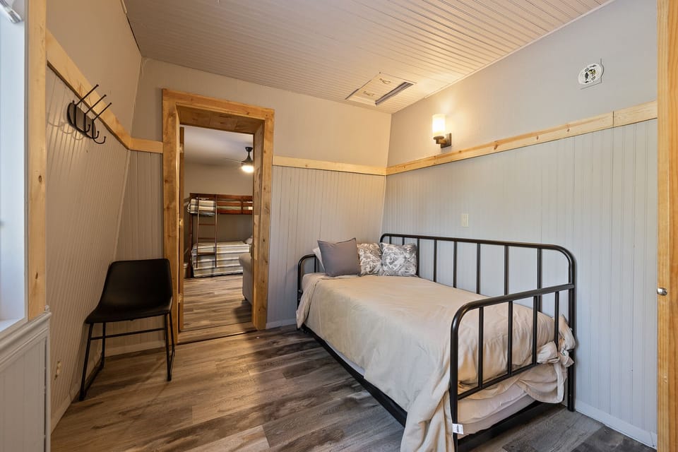 Queen Bedroom With Twin and Rollout Twin