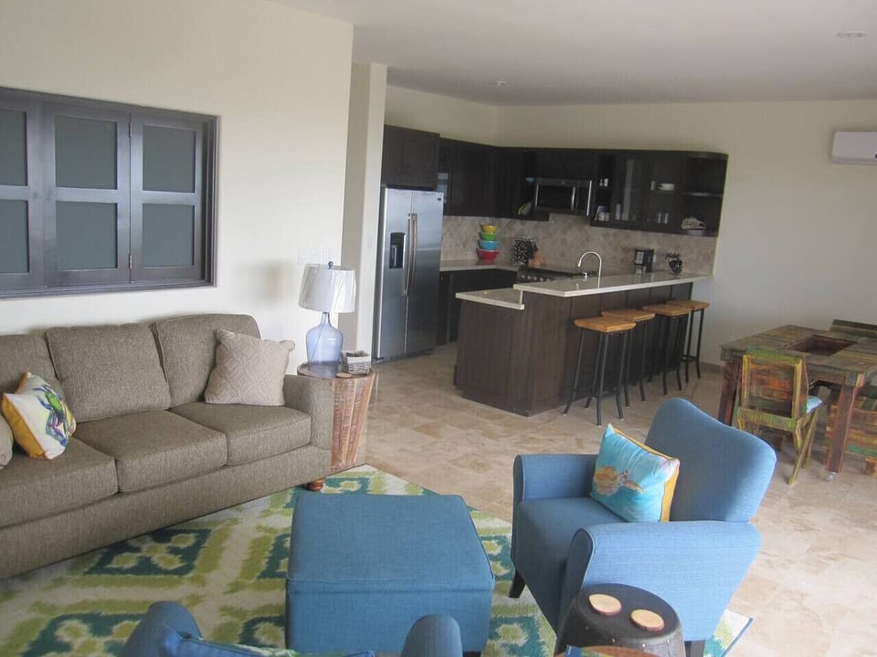 The open layout features custom-designed furniture, offering both style and comfort.