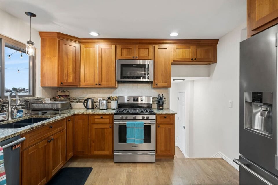 High end appliances make dinners and snacks easy and quick including gas stove.