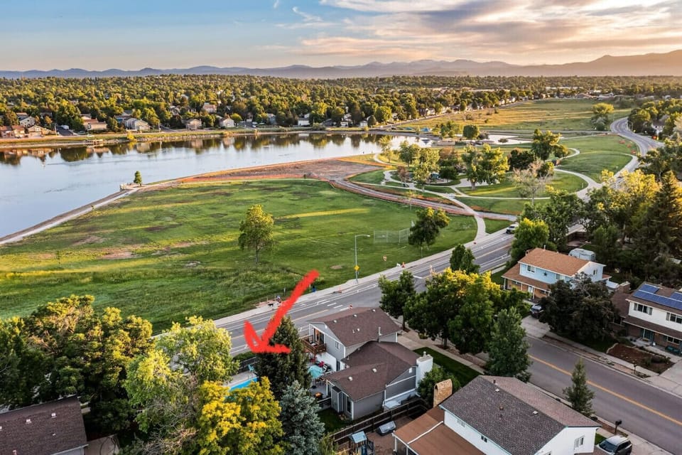 Birdseye View of backyard and beautiful Colorado sunset and view of the lake & pool. Walk around lake 1.5 miles and view of the mountains and Lake from the house is so fabulous!