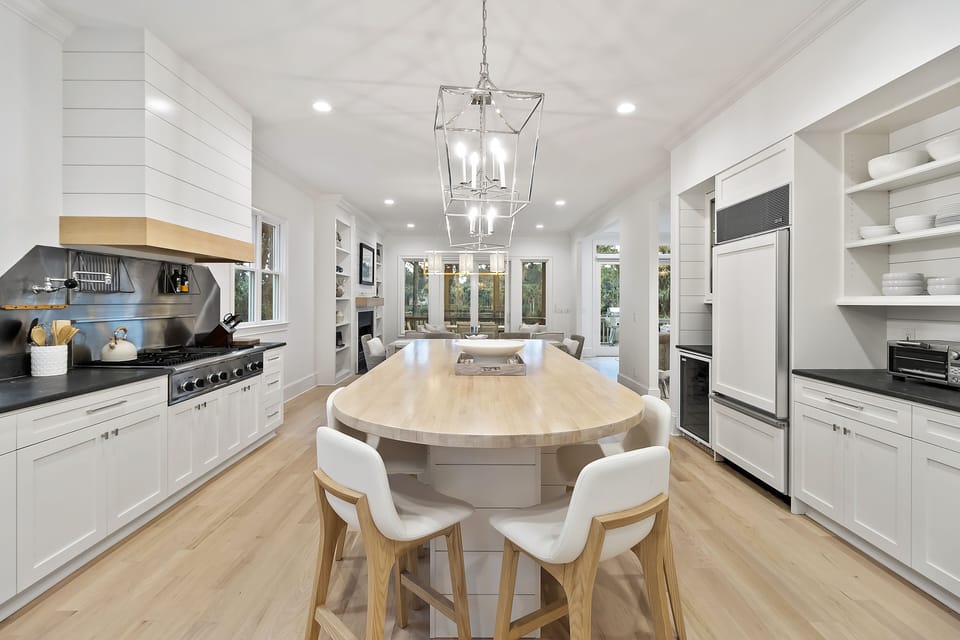 Bar seating for four, a double oven, and gas range.