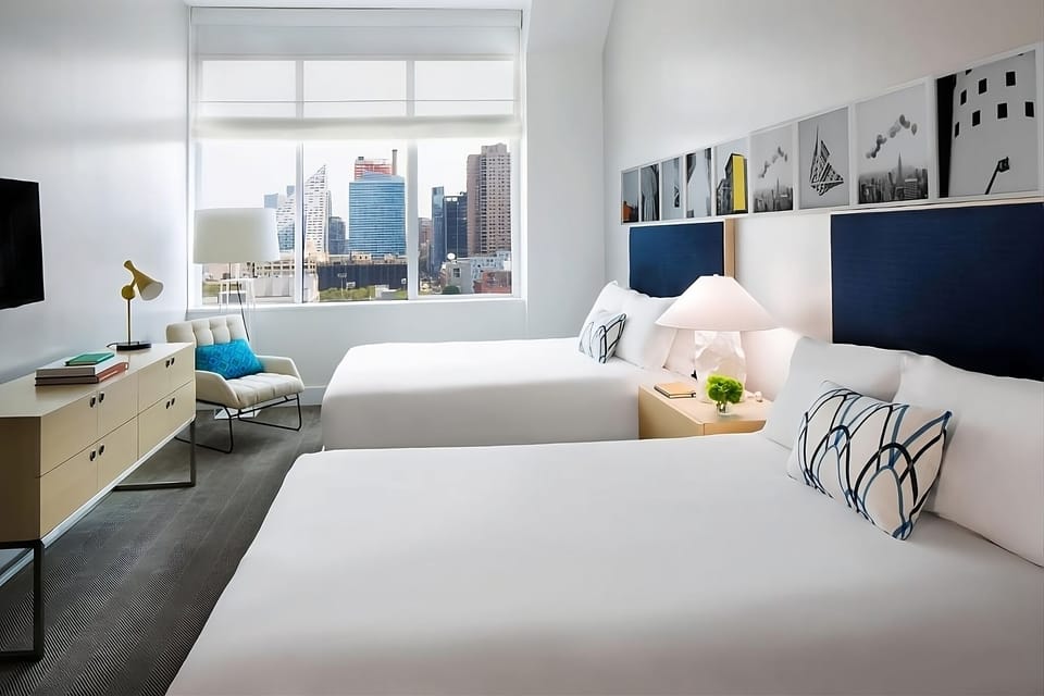 Stretch out in a bright room with two inviting beds.