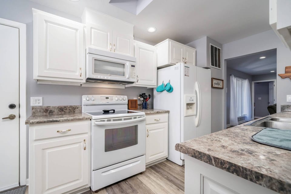 Kitchen W/ everything you need to whip up a good meal after a day on the golf course