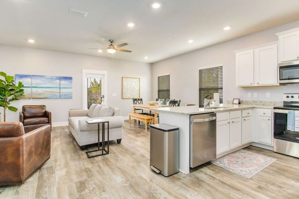 With this open concept living room, dining area and kitchen, you can be with your family or friends in the living room while cooking in the kitchen.