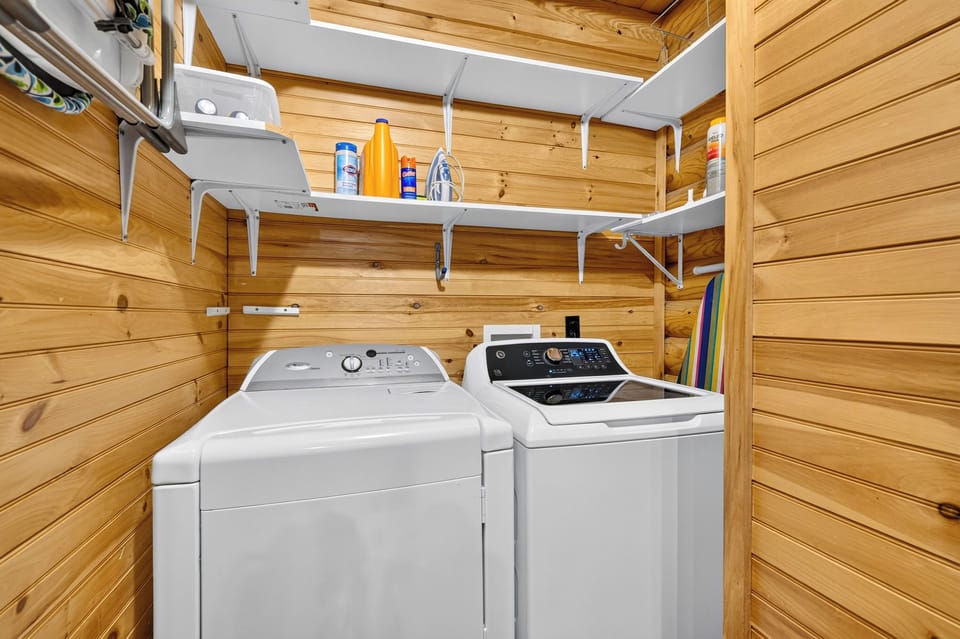 Keep your wardrobe fresh with the in-unit washer and dryer and convenient storage shelving.