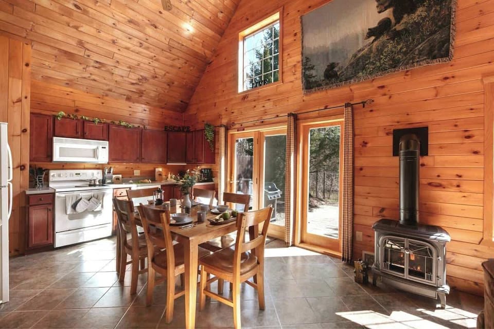 The kitchen is the perfect combination of cozy and convenient, equipped with wood furniture and cabinetry, appliances, and all the cookware, utensils, and dishware you'll need.

Or, open the door to the private patio and enjoy a meal al fresco!