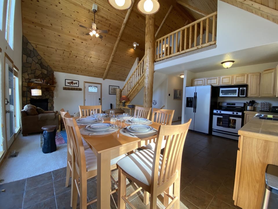 Settle in for meal time or a good board game around the high top dining table