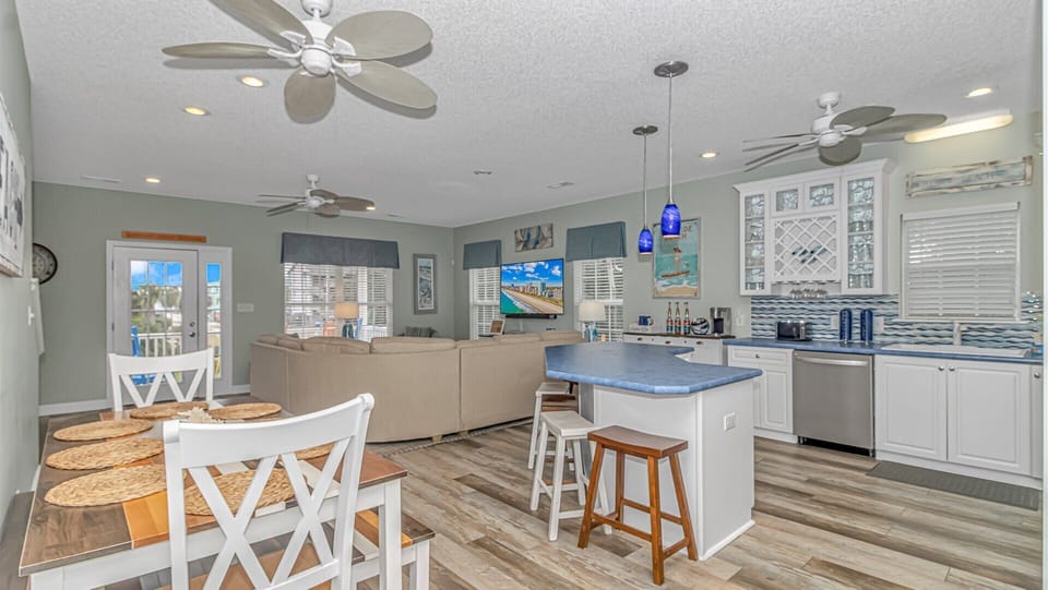 Relax in this bright open-concept space where your kitchen, dining, and living areas flow together seamlessly with coastal charm and modern comfort.