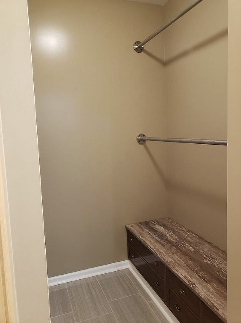 Primary bedroom walk-in closet