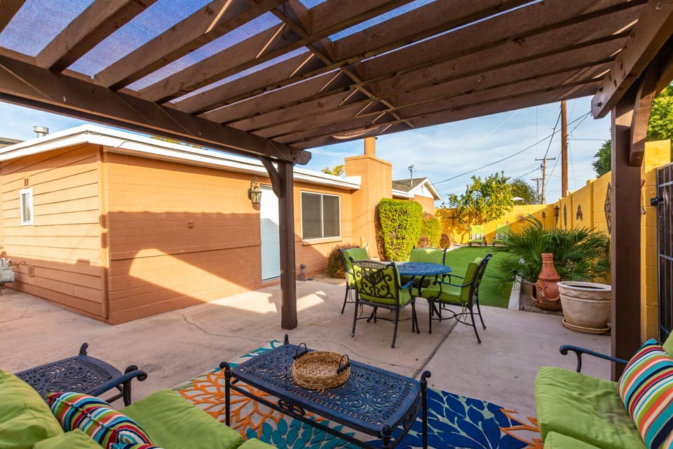 Great backyard patio with seating and dining table