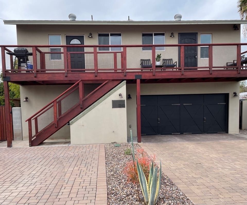 The apt is on top level of this free standing garage.  Prkg on left for 2 cars