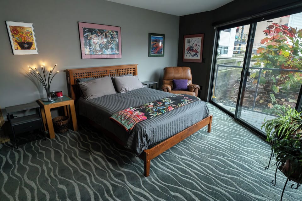 Nearly new queen mattress. 100% cotton sheets. Remote control blinds.