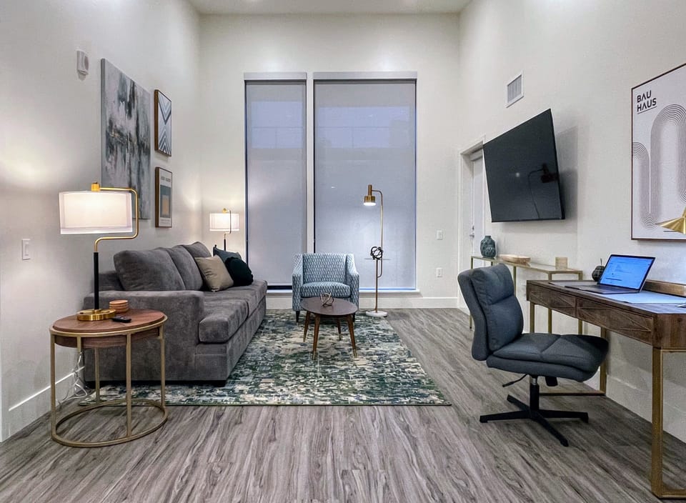 Living Room with comfy work Desk and 65" Roku 4K smart TV