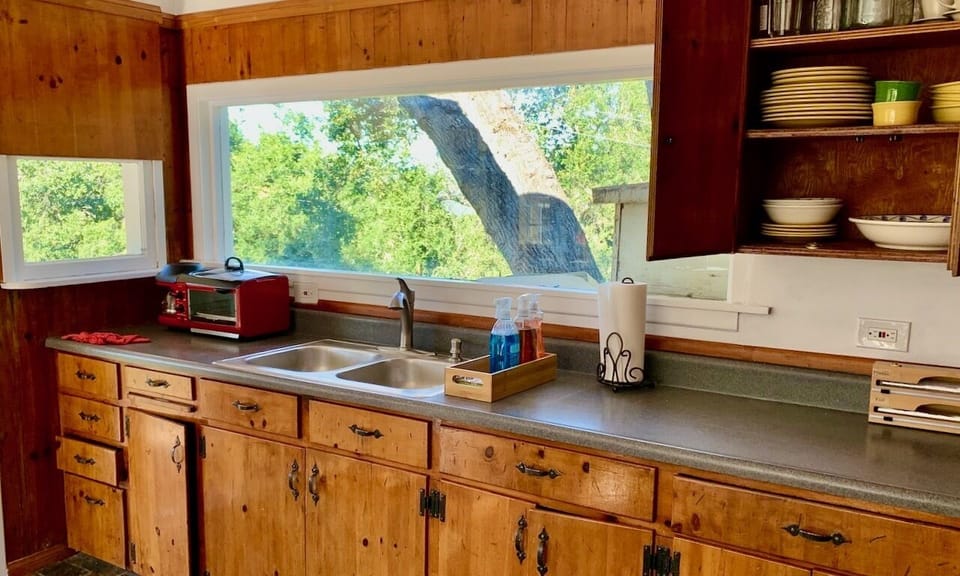 Kitchen Counter With 1950's Aged Handmade Original Pine Cabinets. Mountain Views