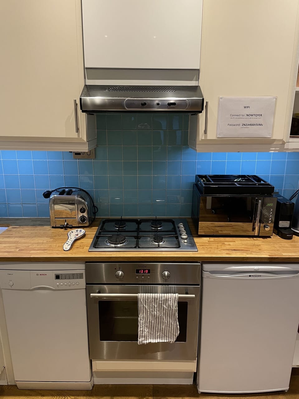 Fully equipped kitchen with dishwasher and fridge freezer.
