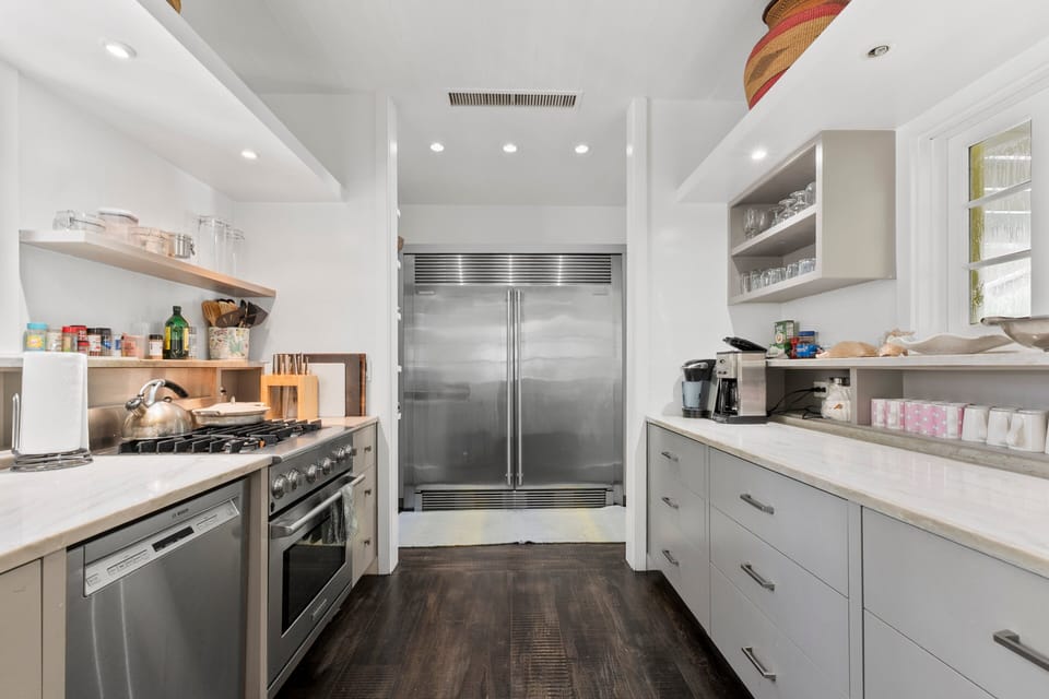 The magnificent chef's kitchen, luxuriously finished in granite and stainless steel