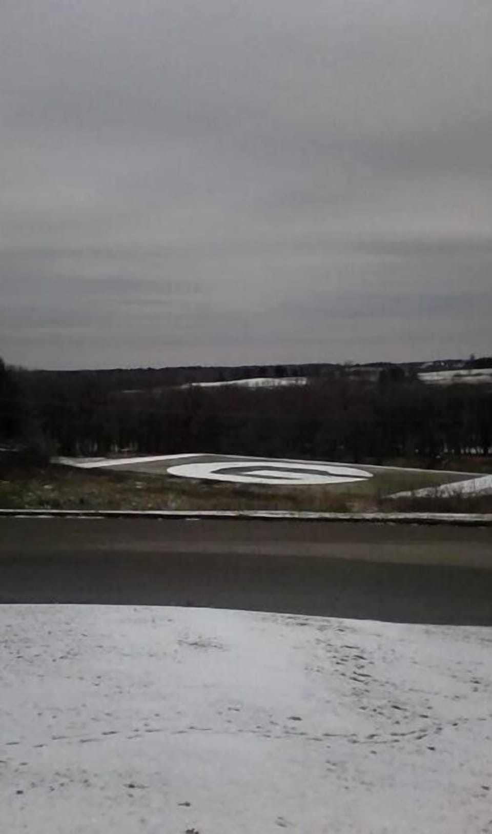 The football field during the first snowfall of the year. 