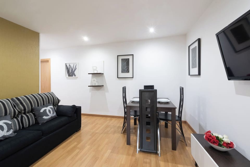 The living room has a comfortable sofa bed and a dining table with enough space to make your stay as pleasant as possible.