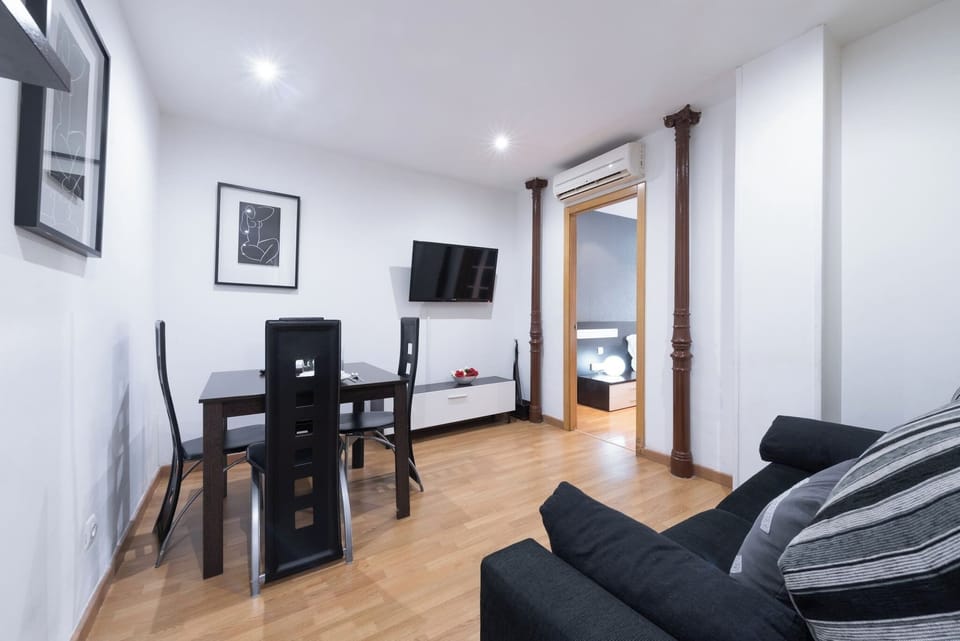 The living room has a comfortable sofa bed and a dining table with enough space to make your stay as pleasant as possible.