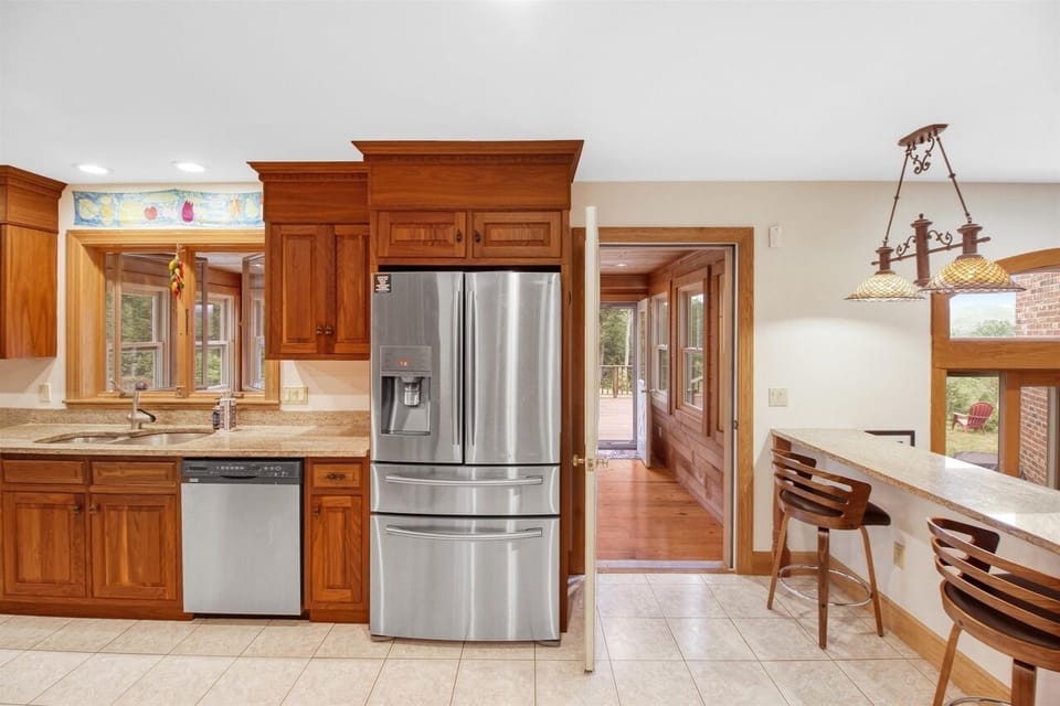 Kitchen opens up to three-season porch